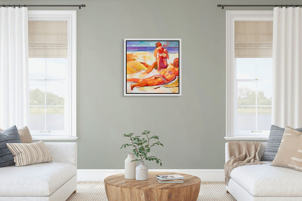 Living room with a framed original painting of two women sunbathing on a beach.