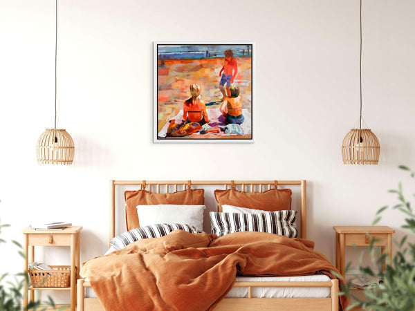 Framed original painting of people enjoying on a beach in a bedroom setting.